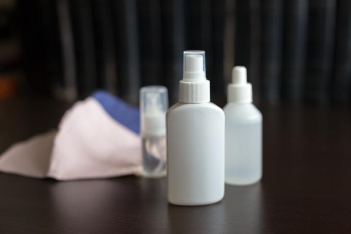 white plastic bottle on brown wooden table